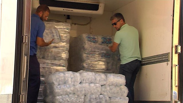 Ice producers say they try to "keep supplies" for their customers, but there is "a lot of market to cover"
