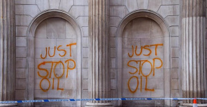 Environmental activists spray paint on government buildings in London